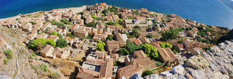 Illustration for article titled This Greek island is the perfect paradise—and supervillain hideout